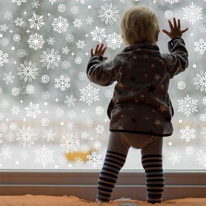 Obrazek z Naklejki na okno - śnieżynki srebrne 52 sztuki 